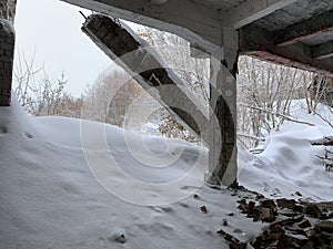Industrial abandoned hall with snow and bricks photo