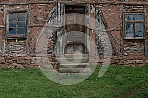 Old ruined house adobe and wood facade in village Gara Bov, Bulgaria