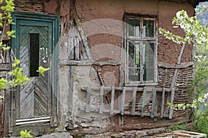 Old ruined house adobe and wood facade in village Gara Bov, Bulgaria