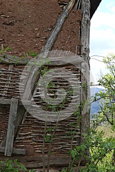 Old ruined house adobe and wood facade in village Gara Bov, Bulgaria