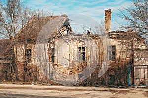 Old ruined house with rundown roof