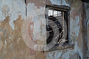 Old ruined house. Wall with a window as background and texture