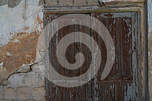 Old ruined house. Wall with a window as background and texture