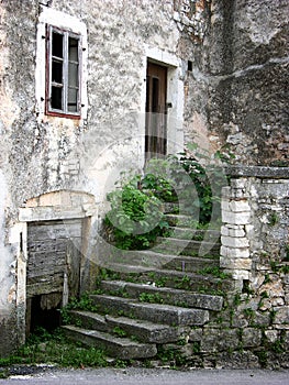 Old ruined house wth broken window and door in Zminj in Istria,Croatia