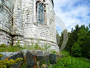 Old ruined stone church on the edge of the forest