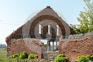 Old ruined stone house in the village. Red brick house built in the last century. Historical value. Demolition of buildings