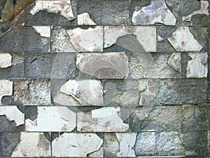 Old ruined tiled wall