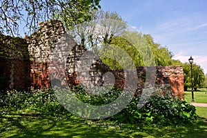 Old Ruined wall from the red brick in the park in summer, Waltham Abbey, UK photo