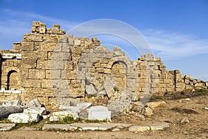 The old ruined walls of the ancient city . Beautiful background with ancient ruins and Sunny summer day.