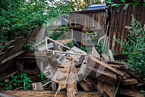 Old ruined wooden house. Two-story building intended for demolition.