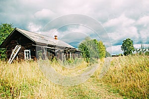 Old ruined wooden house in the village