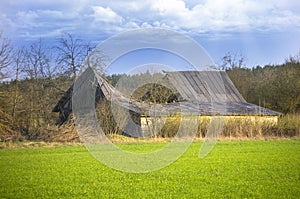 Old ruins of barn with broken roof