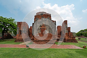 Old ruins temple in green grass field