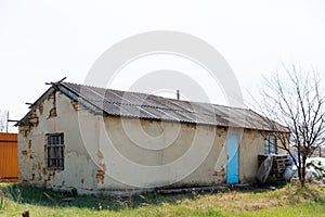 An old run down, weather beaten house that is in need of repair