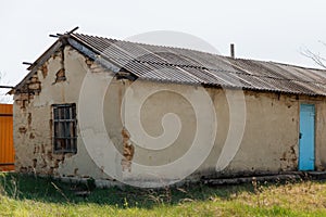 An old run down, weather beaten house that is in need of repair