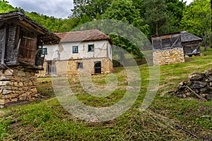 Old rundown houses and surrounding objects in the countryside