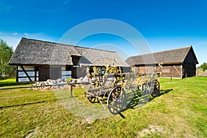 Old rural barn in Poland and threshing-machine- XIXth century