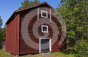 Old rural house from Norrland in red, white and black wood photo
