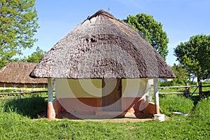 Old rural house with a straw roof