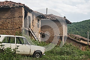 Old rural houses and abandoned vintage car