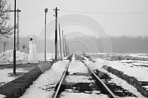 Old, rural railroads and railway station in winter