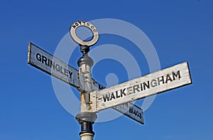 Old rural road sign, with postbox