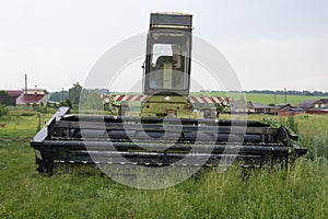 Old rural tractor with a mower for agricultural work