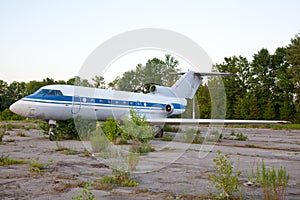 Old russian airplane is on the disused airfield photo