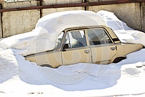 Old Russian car under snow