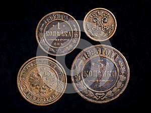 Old Russian coins 19th century, copper money on black background