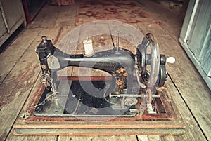 Old Russian hand sewing machine on the floor