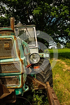 Old Russian tractor with a lamp and tire