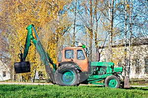 Old russian tractor with loader