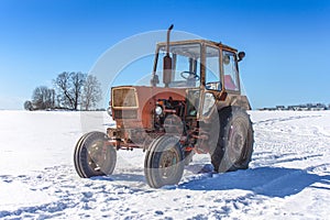 Old Russian tractor in snow