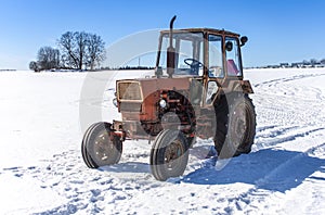 Old Russian tractor in snow