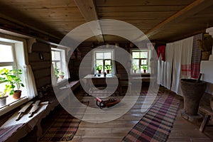 An old Russian village hut showing the life of ancient people and peasants with furnished furniture