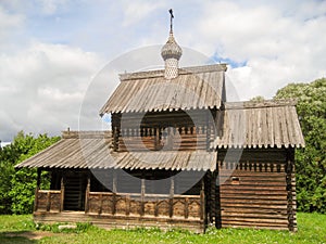 Old Russian wooden log tower with cupolas