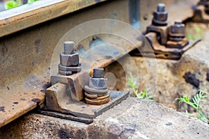 Old rust bolts for mounting rails on railroad track. Bolt conne