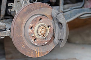 old rust brake disk repairing. checking brakes at transportation