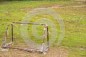 Old rust football goal abandoned soccer goal field located on the ground