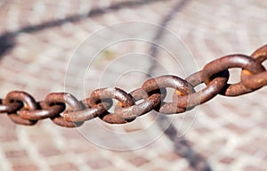 Old rust massive iron chain on sunlight photo