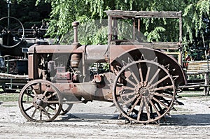 An old, rusted, abandoned tractor.