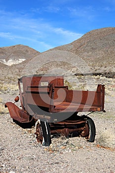 Old rusted car in junk yard