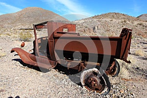 Old rusted car in junk yard