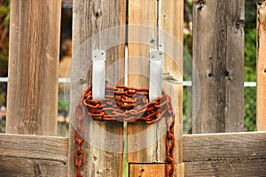 Old Rusted Chain on a Wooden Gate