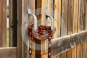 Old Rusted Chain on a Wooden Gate