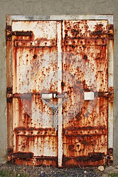 Old rusted doors padlocked close