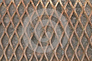 Old rusted iron grates of the bridge walkway