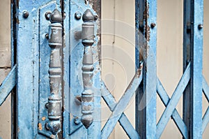 Old rusted lock on blue rusty iron gate