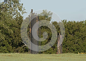 Old rusted oil storage tanks in the State of Oklahoma in the United States of America.